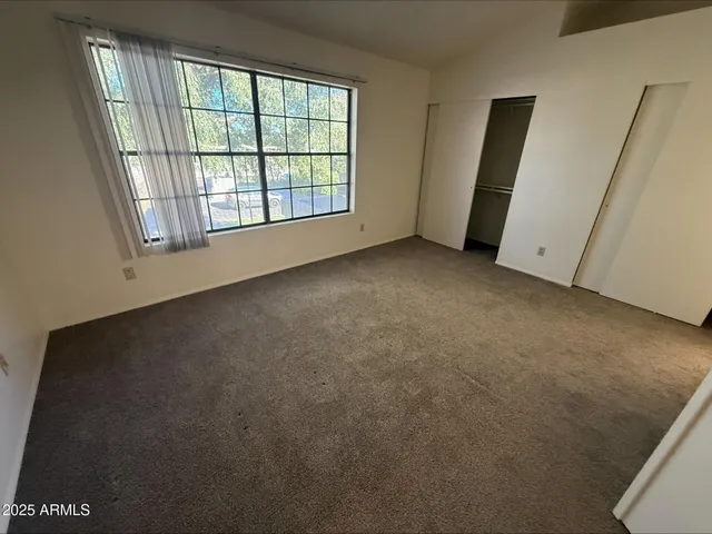 an empty room with windows