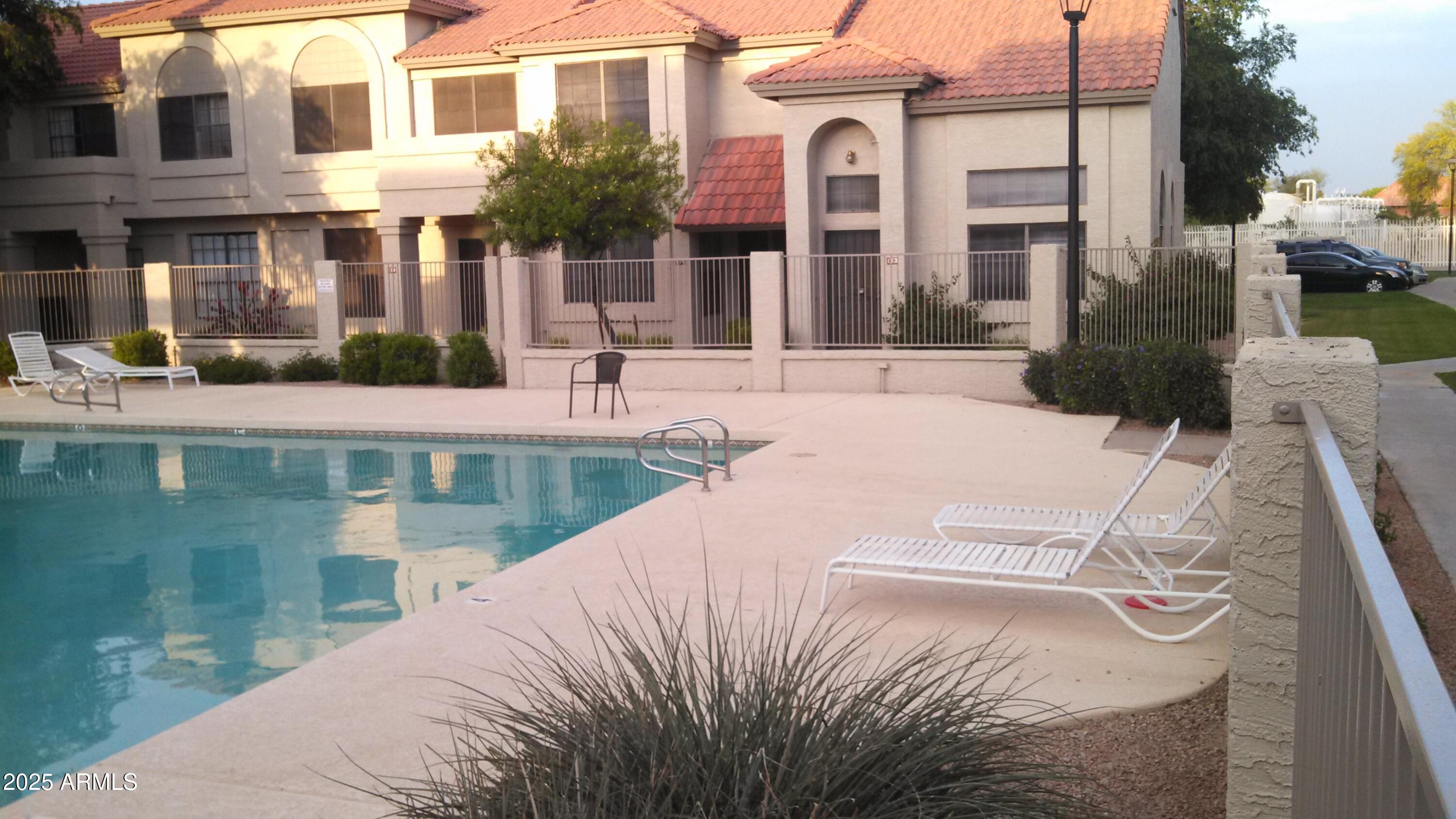 3930 West Monterey Street, Unit 113 Chandler, AZ 85226 - Photo 18 of 20 a view of a house with pool and sitting area