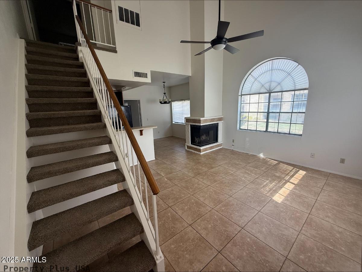 3930 West Monterey Street, Unit 113 Chandler, AZ 85226 - Photo 2 of 20 wooden floor in an empty room with a window