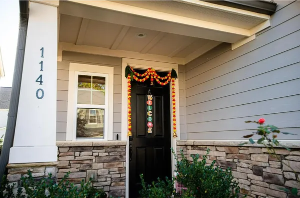a front view of a house with a yard