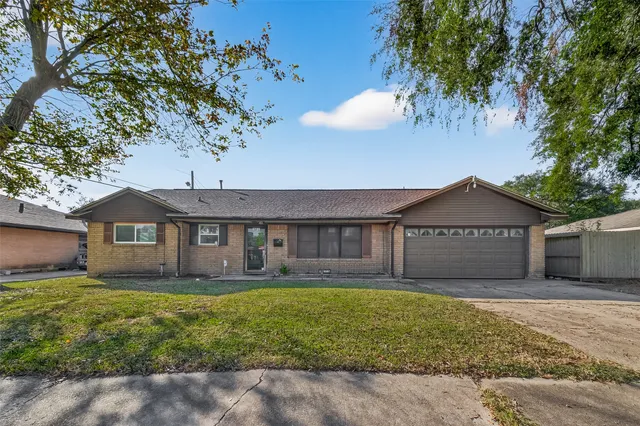 a kitchen with stainless steel appliances granite countertop a sink a stove and a granite counter tops