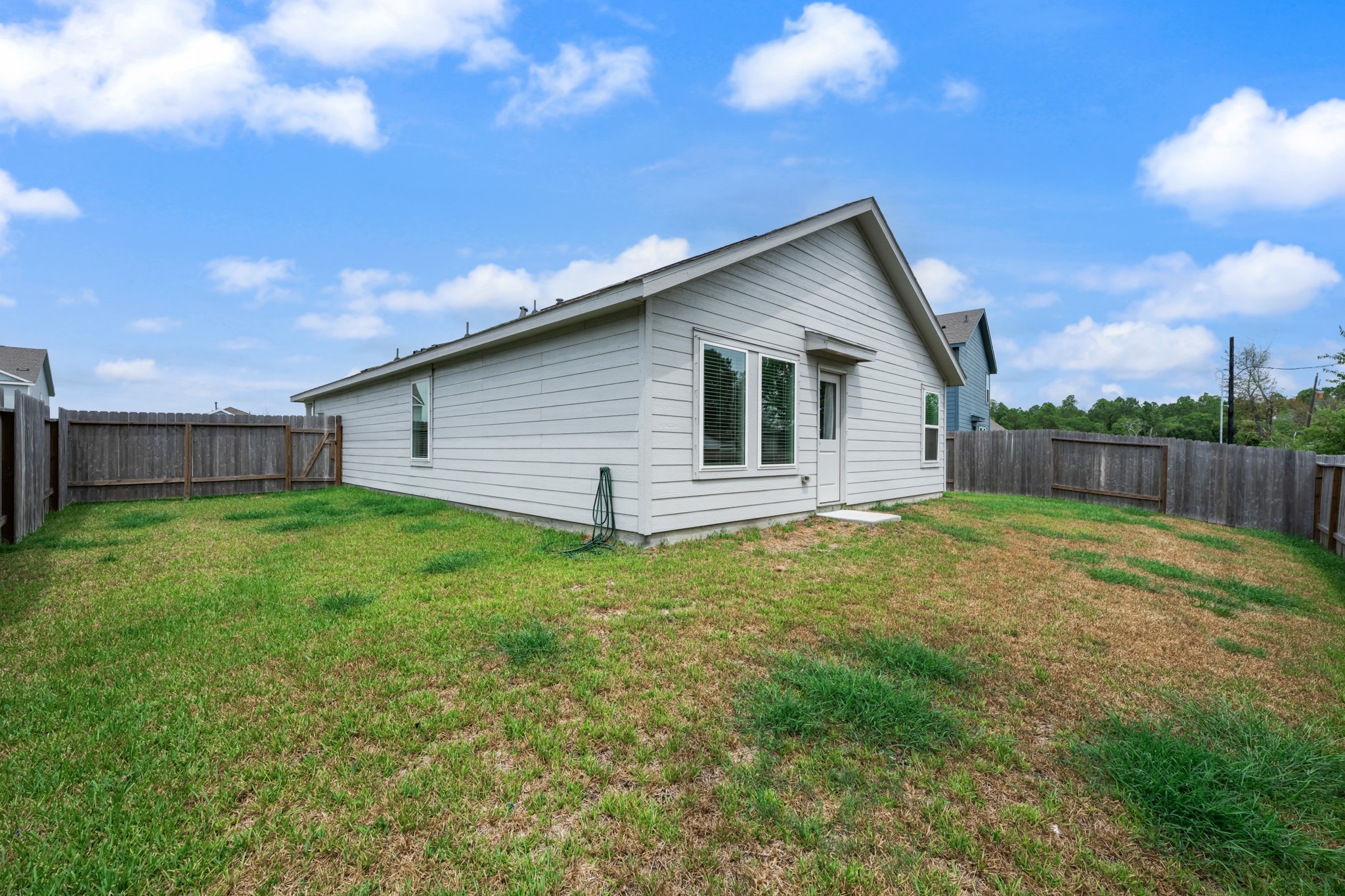 252 Houston Street Angleton, TX 77515 - Photo 39 of 49 Another perspective showcases the fenced outdoor area and convenient rear entry to the home.