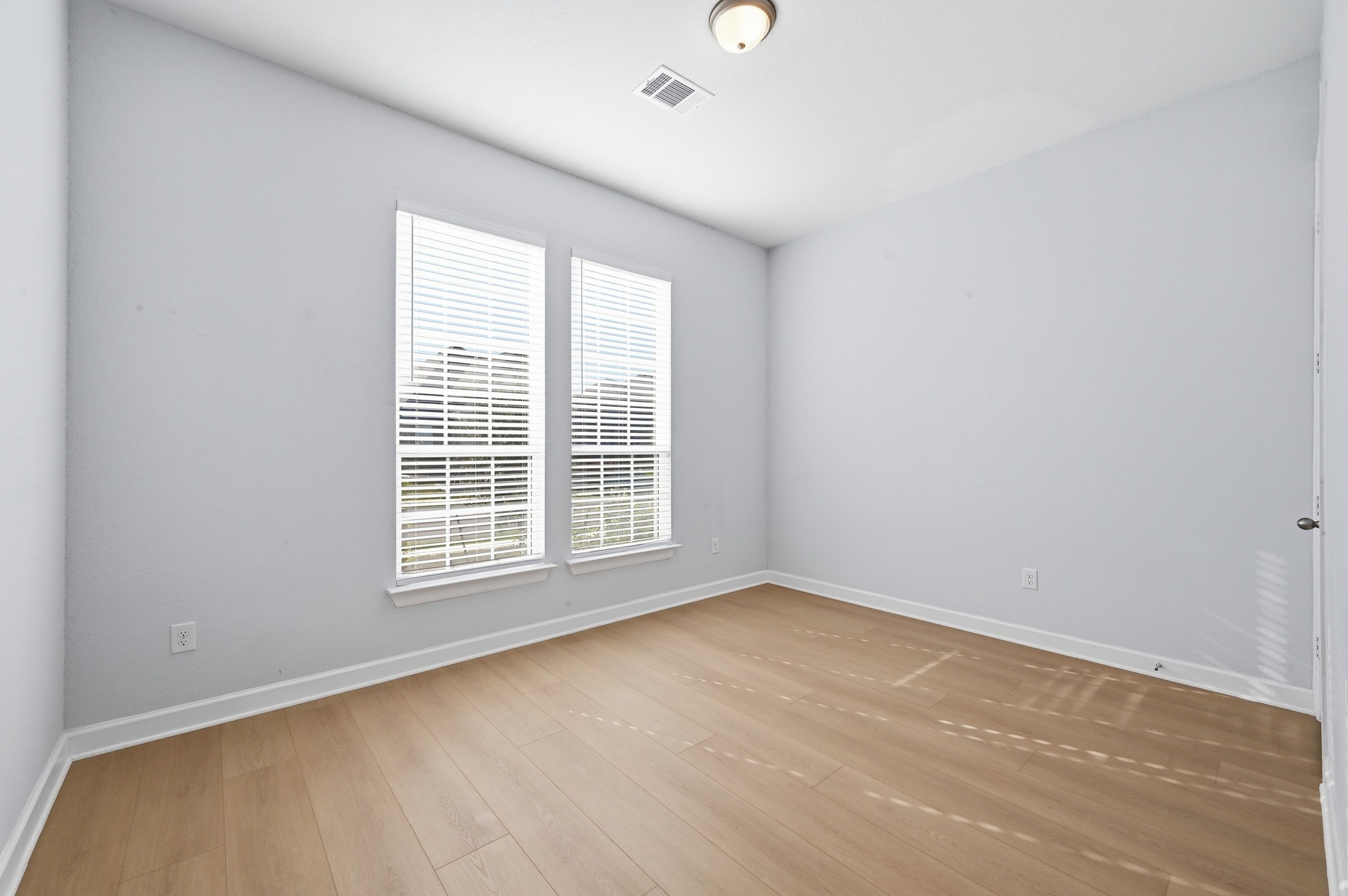 176 Wild Pecan Loop Buda, TX 78610 - Photo 20 of 30 Unfurnished room with baseboards and light wood finished floors