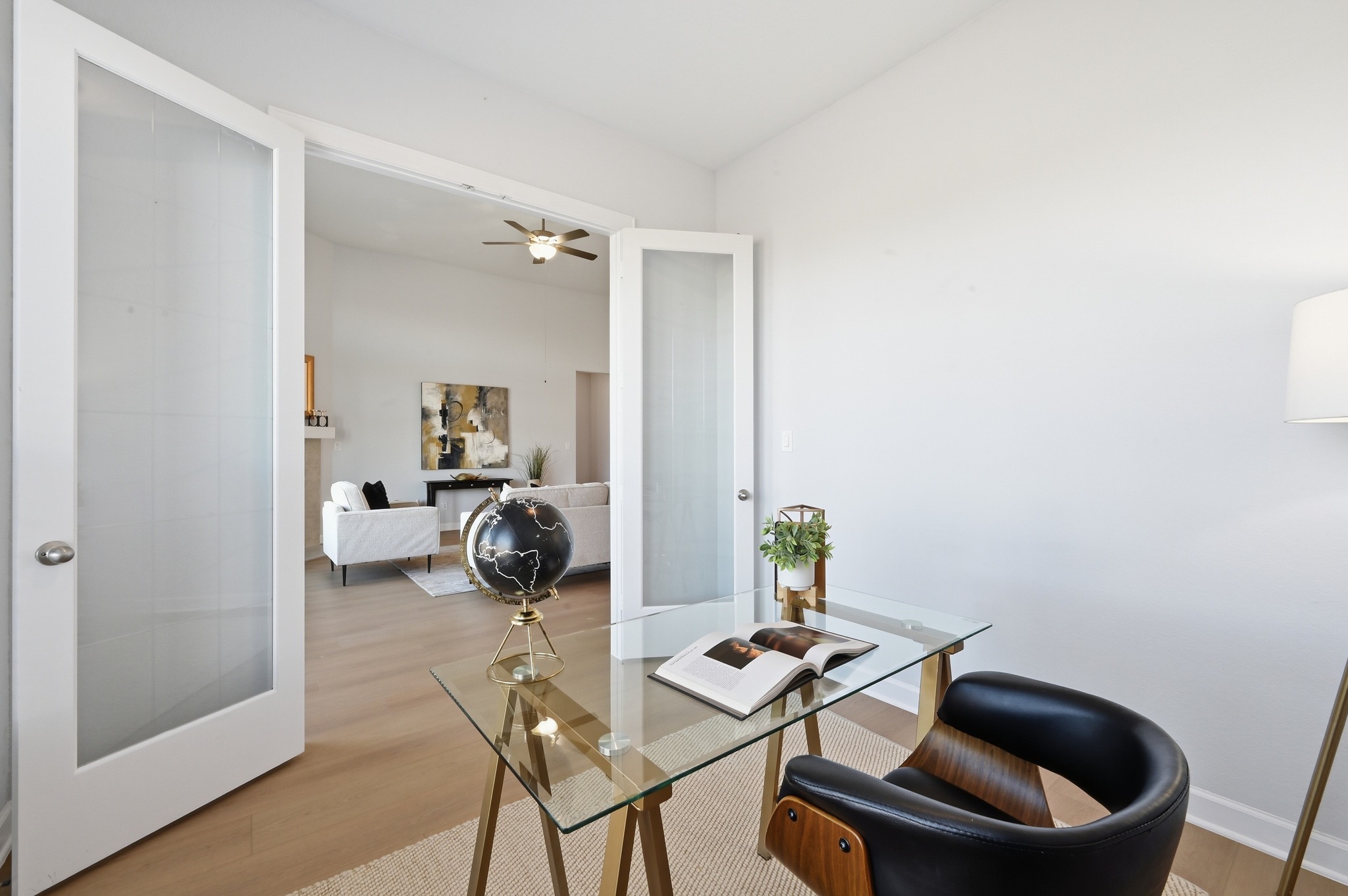 176 Wild Pecan Loop Buda, TX 78610 - Photo 8 of 30 Home office with light wood-style flooring and ceiling fan