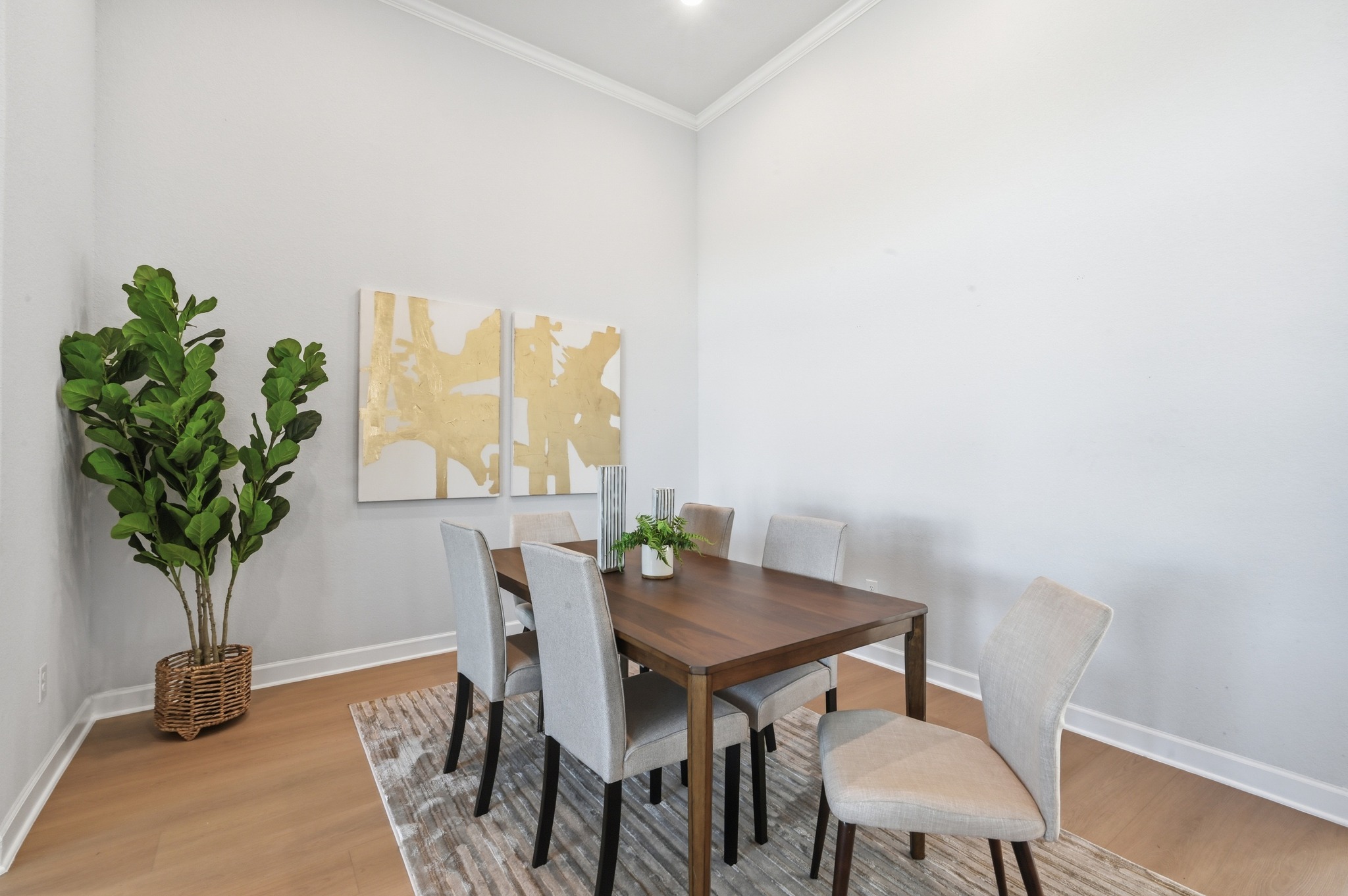 176 Wild Pecan Loop Buda, TX 78610 - Photo 9 of 30 Dining room featuring light wood-style floors and crown molding