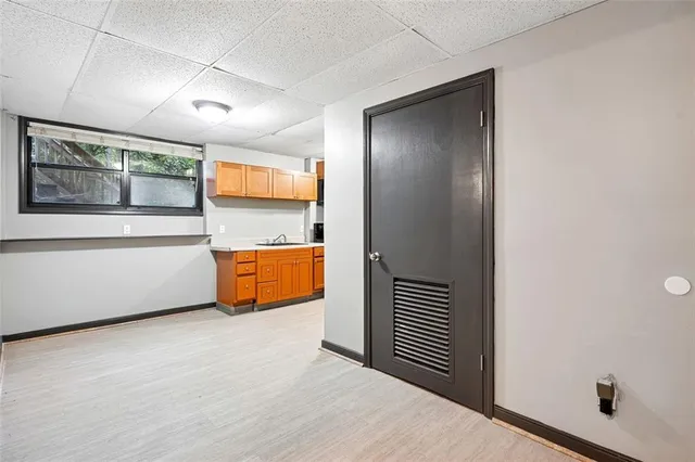 a kitchen with stainless steel appliances a refrigerator and a microwave
