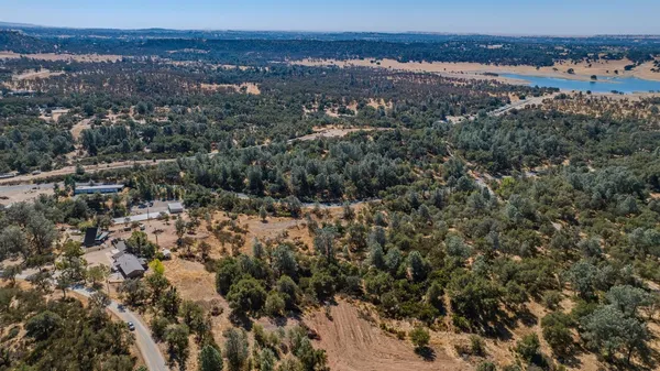 an aerial view of residential house and green space