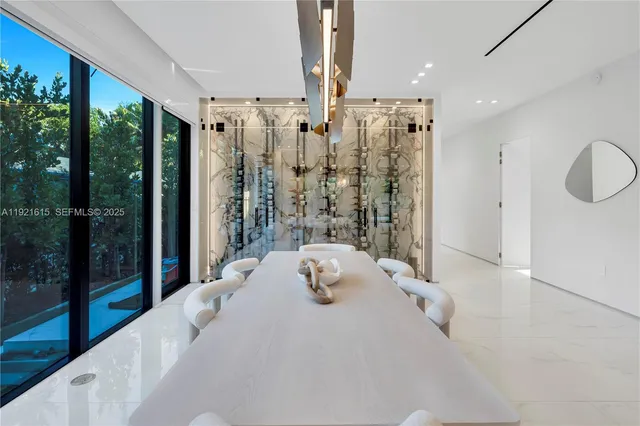a large kitchen with kitchen island a large counter top and a sink