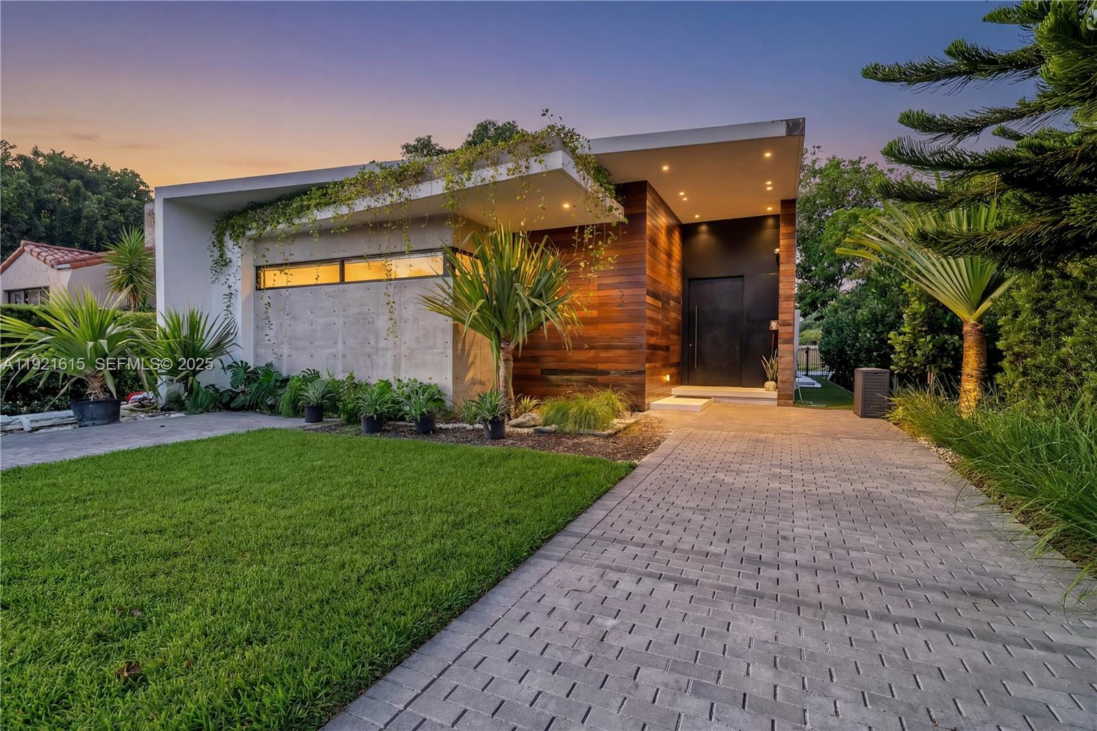 34 Southwest 26th Road Miami, FL 33129 - Photo 2 of 68 a front view of a house with a yard
