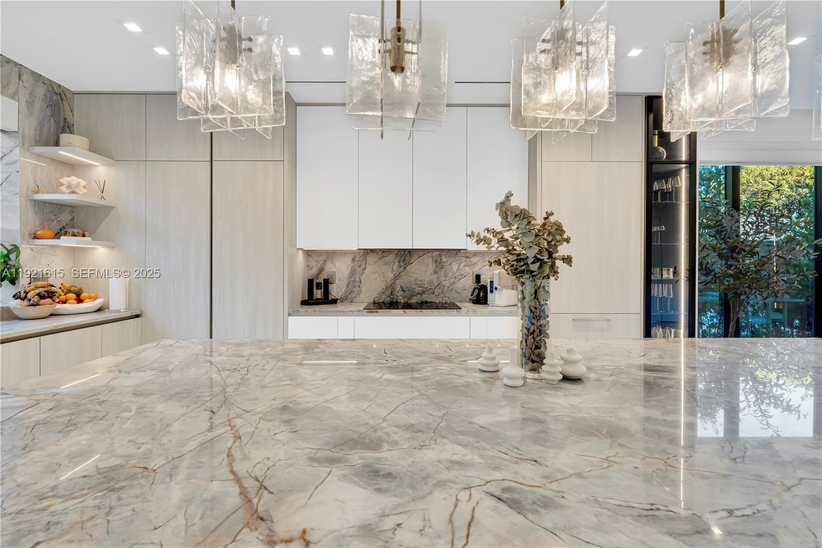 34 Southwest 26th Road Miami, FL 33129 - Photo 23 of 68 a view of kitchen with granite countertop cabinets and chandelier