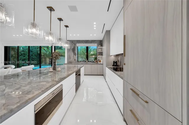 a spacious bedroom with a bed and a dresser with mirror