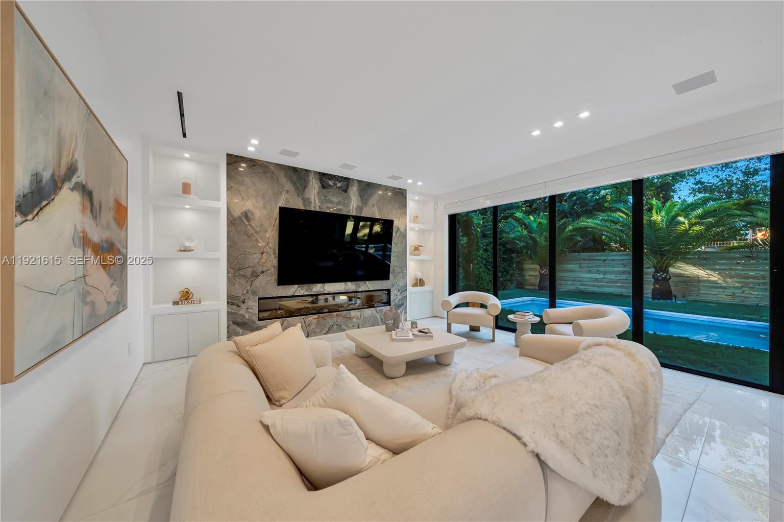 34 Southwest 26th Road Miami, FL 33129 - Photo 31 of 68 a living room with furniture and a flat screen tv