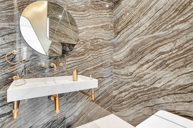 a bathroom with a double vanity sink mirror and shower