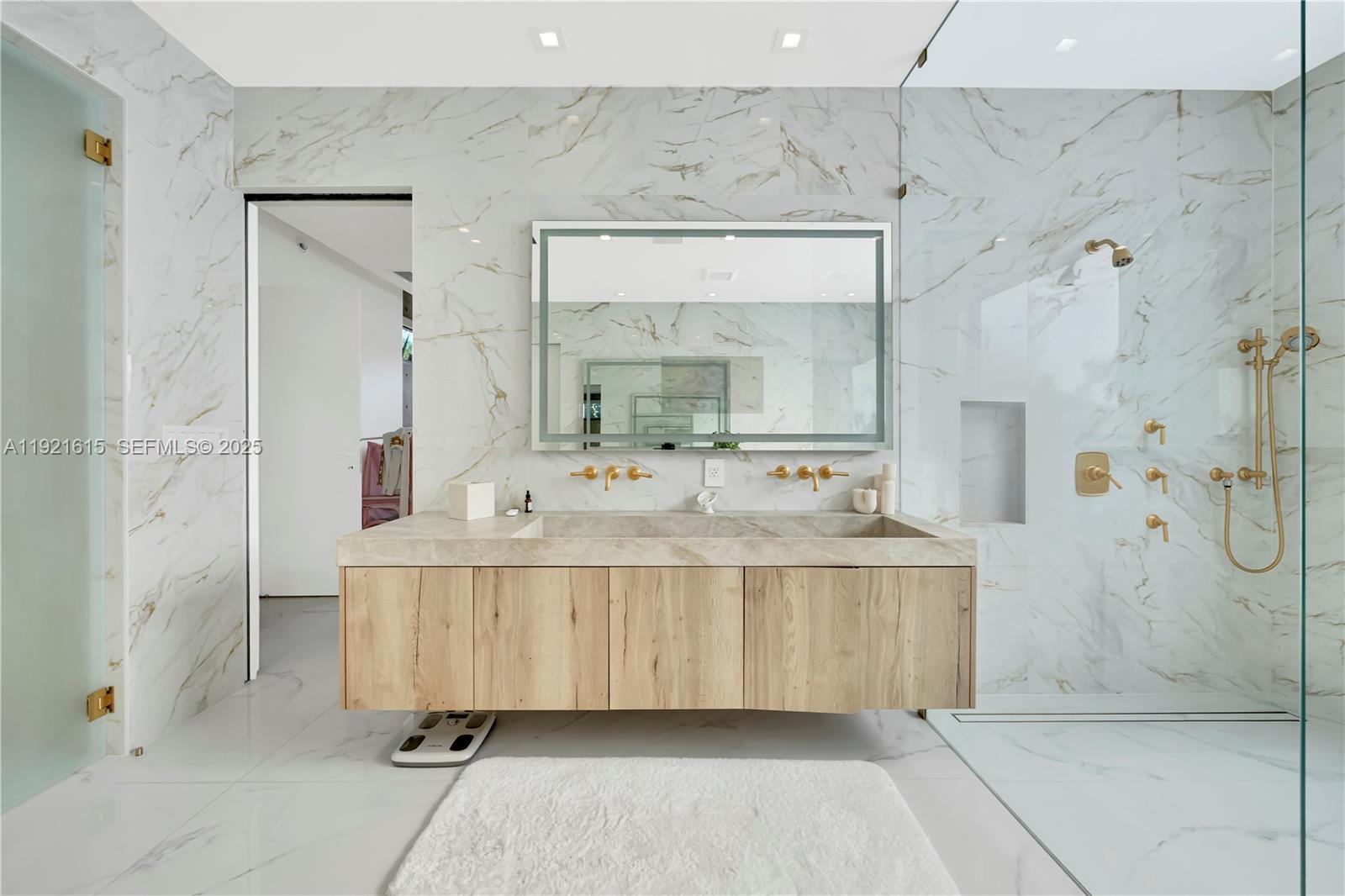 34 Southwest 26th Road Miami, FL 33129 - Photo 39 of 68 a bathroom with a double vanity sink mirror and shower