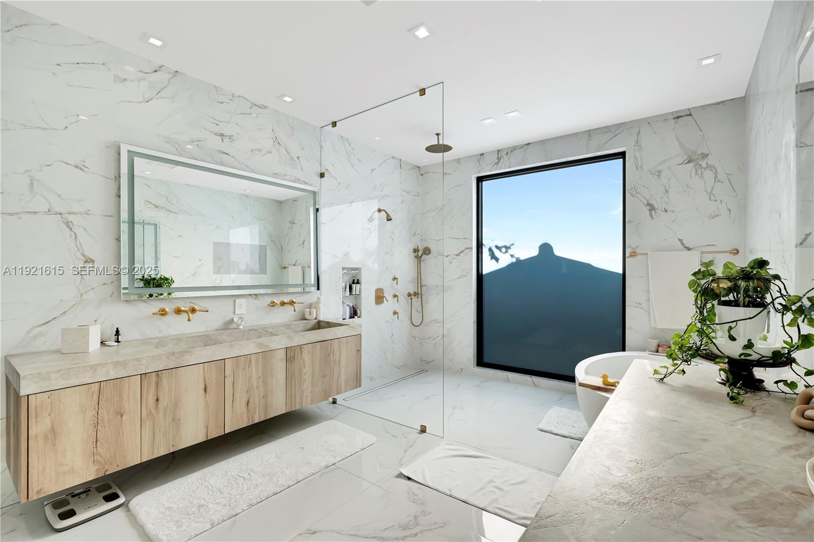 34 Southwest 26th Road Miami, FL 33129 - Photo 43 of 68 a large bathroom with a tub sink and glass door