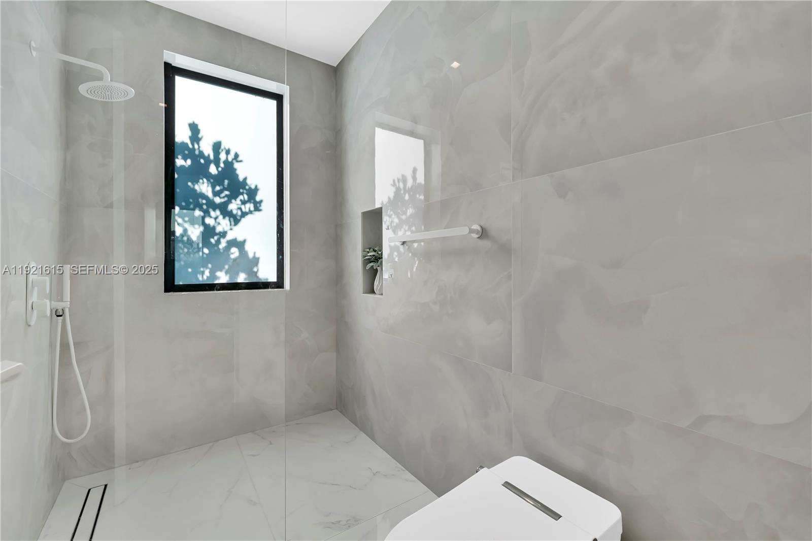 34 Southwest 26th Road Miami, FL 33129 - Photo 49 of 68 a bathroom with a toilet and a shower