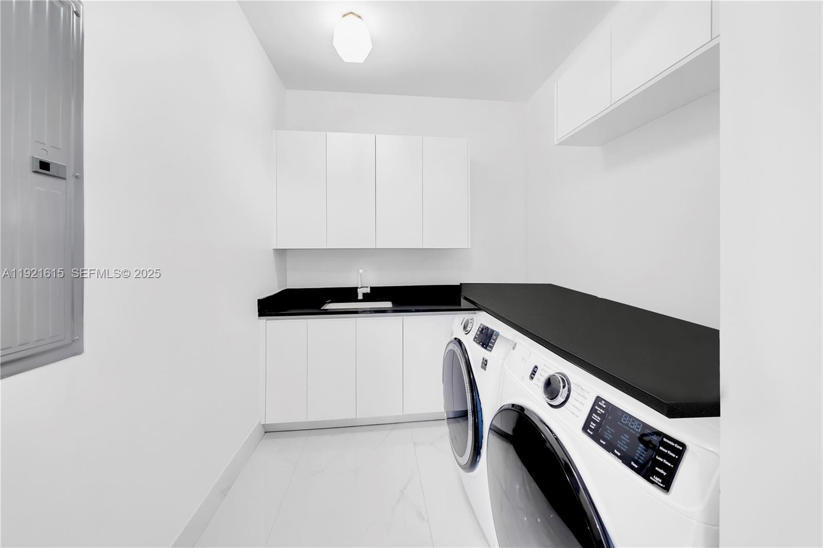 34 Southwest 26th Road Miami, FL 33129 - Photo 51 of 68 a utility room with dryer and washer