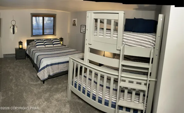 a bedroom with furniture and windows
