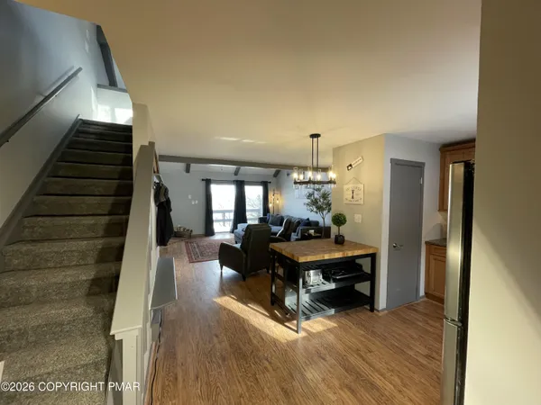 a view of a living room and dining room