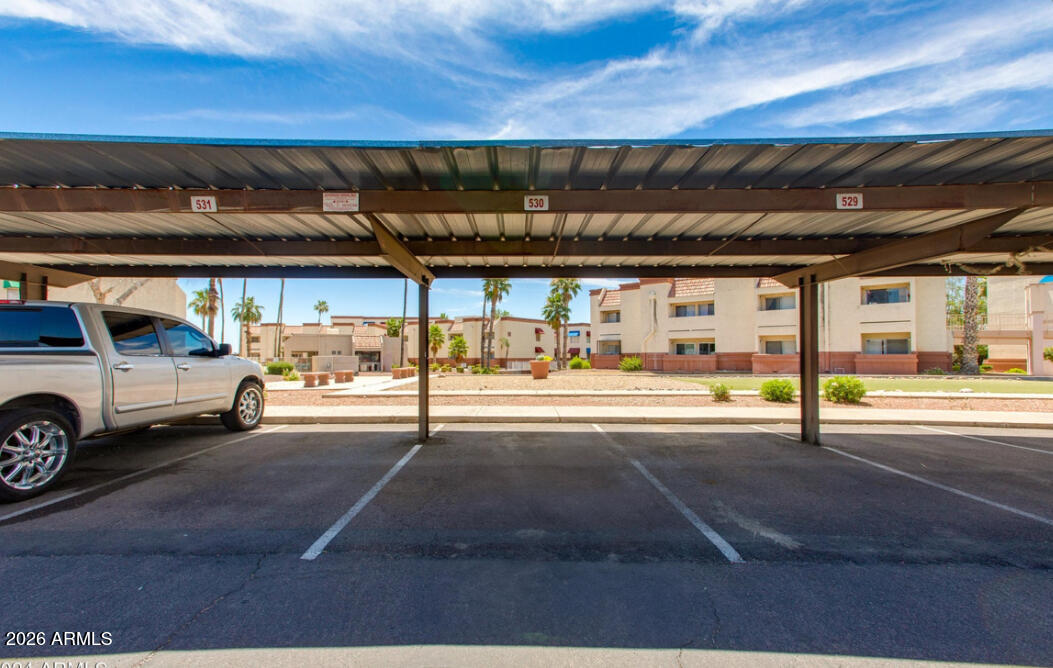 12123 West Bell Road, Unit 219 Surprise, AZ 85378 - Photo 18 of 23 a view of parking area