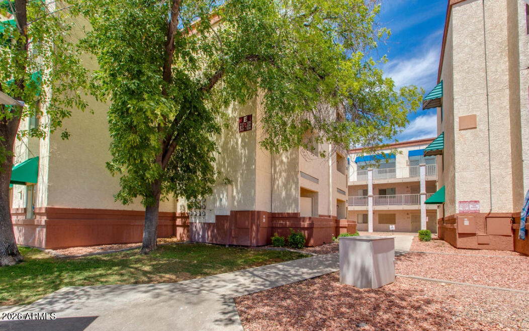 12123 West Bell Road, Unit 219 Surprise, AZ 85378 - Photo 19 of 23 a view of a house with backyard and sitting area