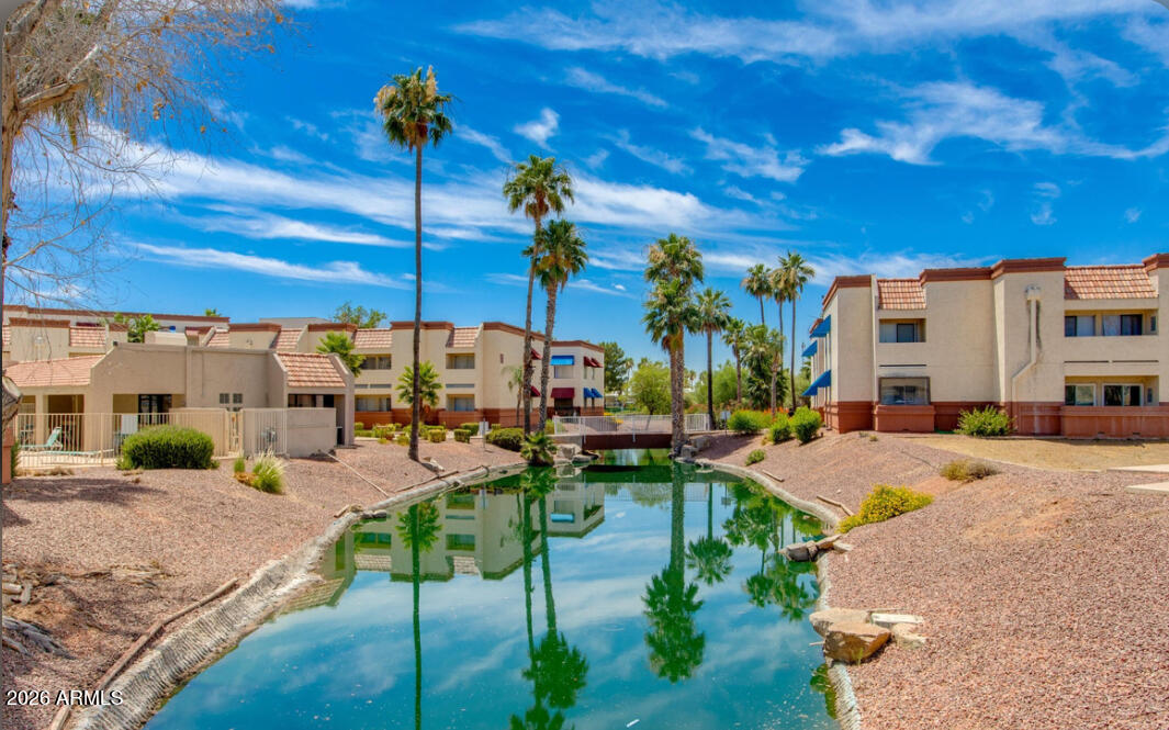 12123 West Bell Road, Unit 219 Surprise, AZ 85378 - Photo 21 of 23 a view of a backyard with a patio