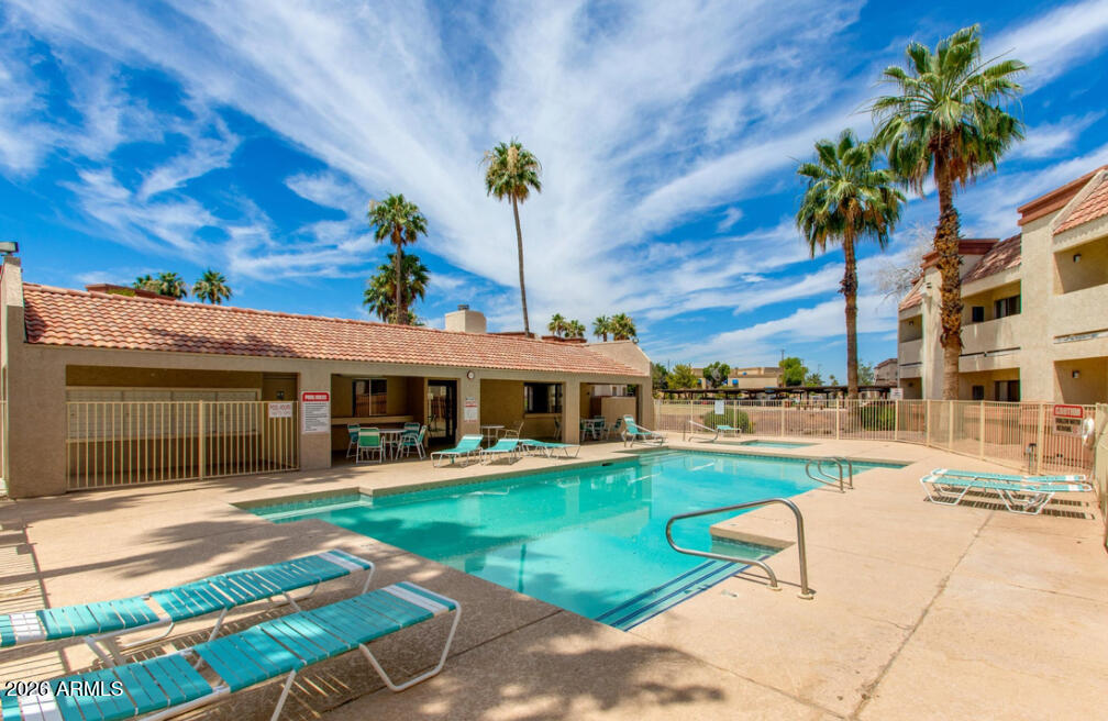 12123 West Bell Road, Unit 219 Surprise, AZ 85378 - Photo 22 of 23 a view of a house with a swimming pool