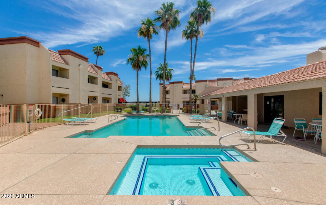 12123 West Bell Road, Unit 219 Surprise, AZ 85378 - Photo 23 of 23 a view of swimming pool with chairs