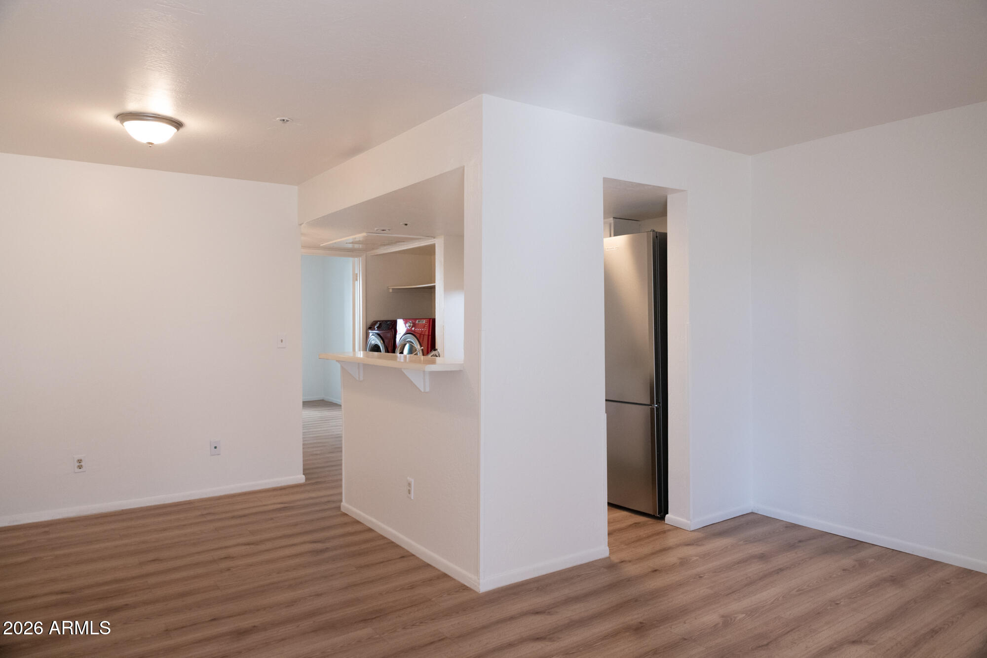 12123 West Bell Road, Unit 219 Surprise, AZ 85378 - Photo 8 of 23 a view of a hallway with wooden floor