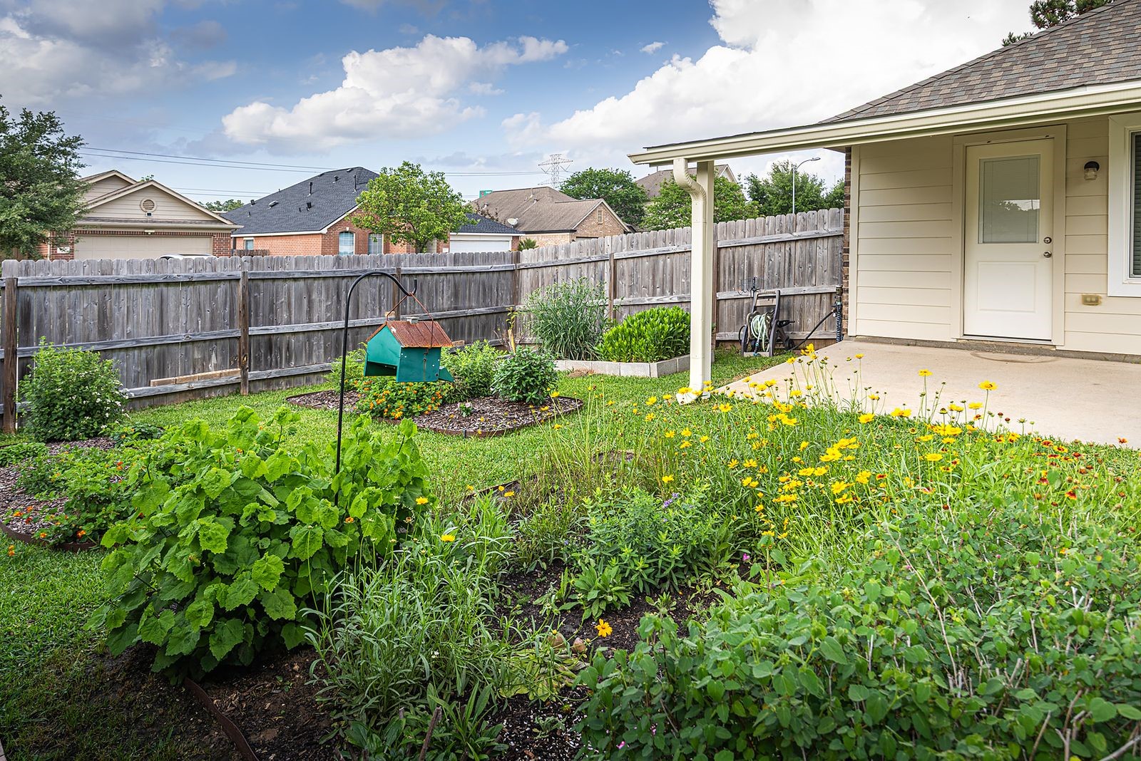 22715 Imperial Ivy Court Spring, TX 77373 - Photo 32 of 33 a view of a backyard with a garden