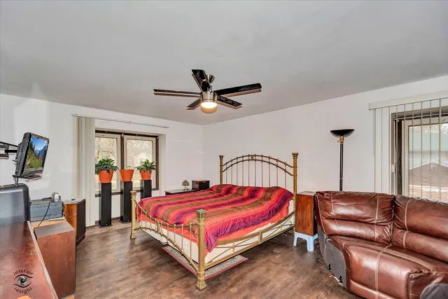 a bedroom with a bed and window