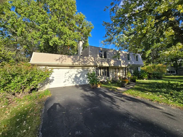 a view of a street with houses on both side of it
