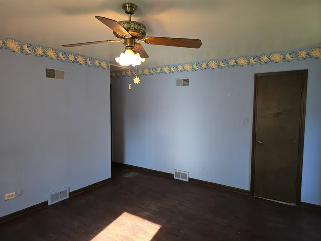 a view of a chandelier fan in a room