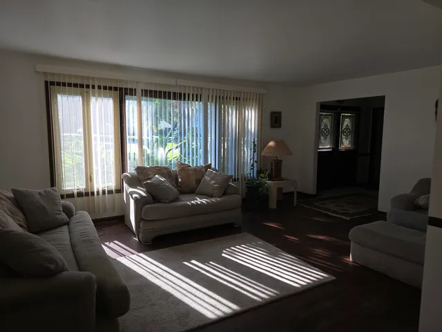 a living room with furniture and a rug