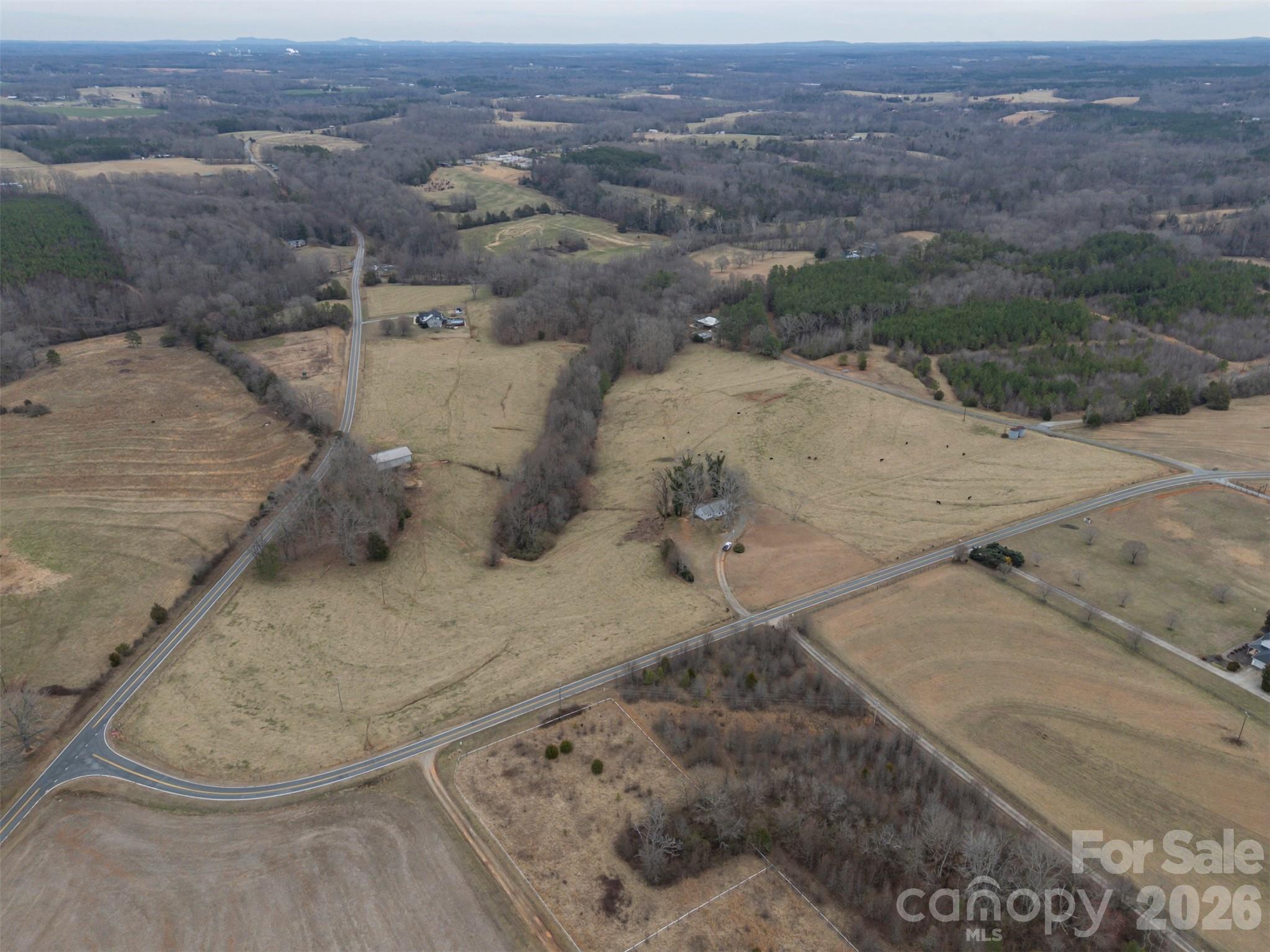 0 Red Barn Road Ellenboro, NC 28040 - Photo 11 of 28 an aerial view of a house with a mountain