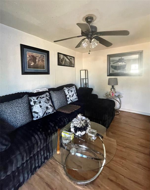 3525 Colonial Avenue Dallas, TX 75215 - Photo 4 of 24 Living room featuring wood finished floors and a ceiling fan