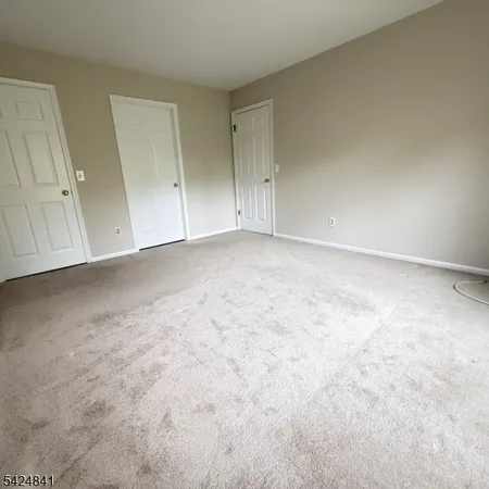 a view of an empty room and entryway