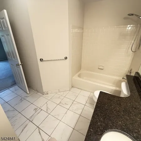 a bathroom with a sink and a shower