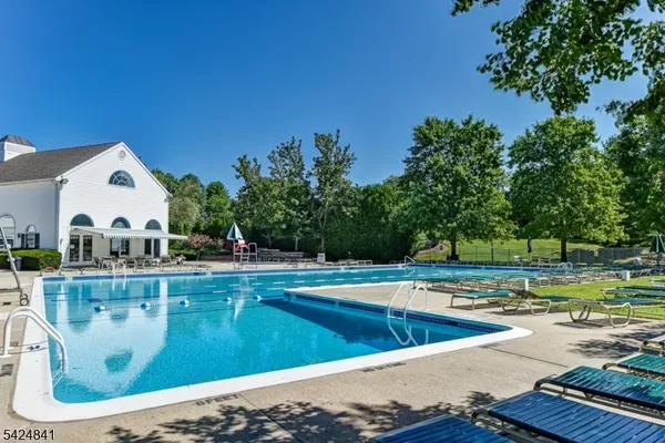 a view of a swimming pool with a yard
