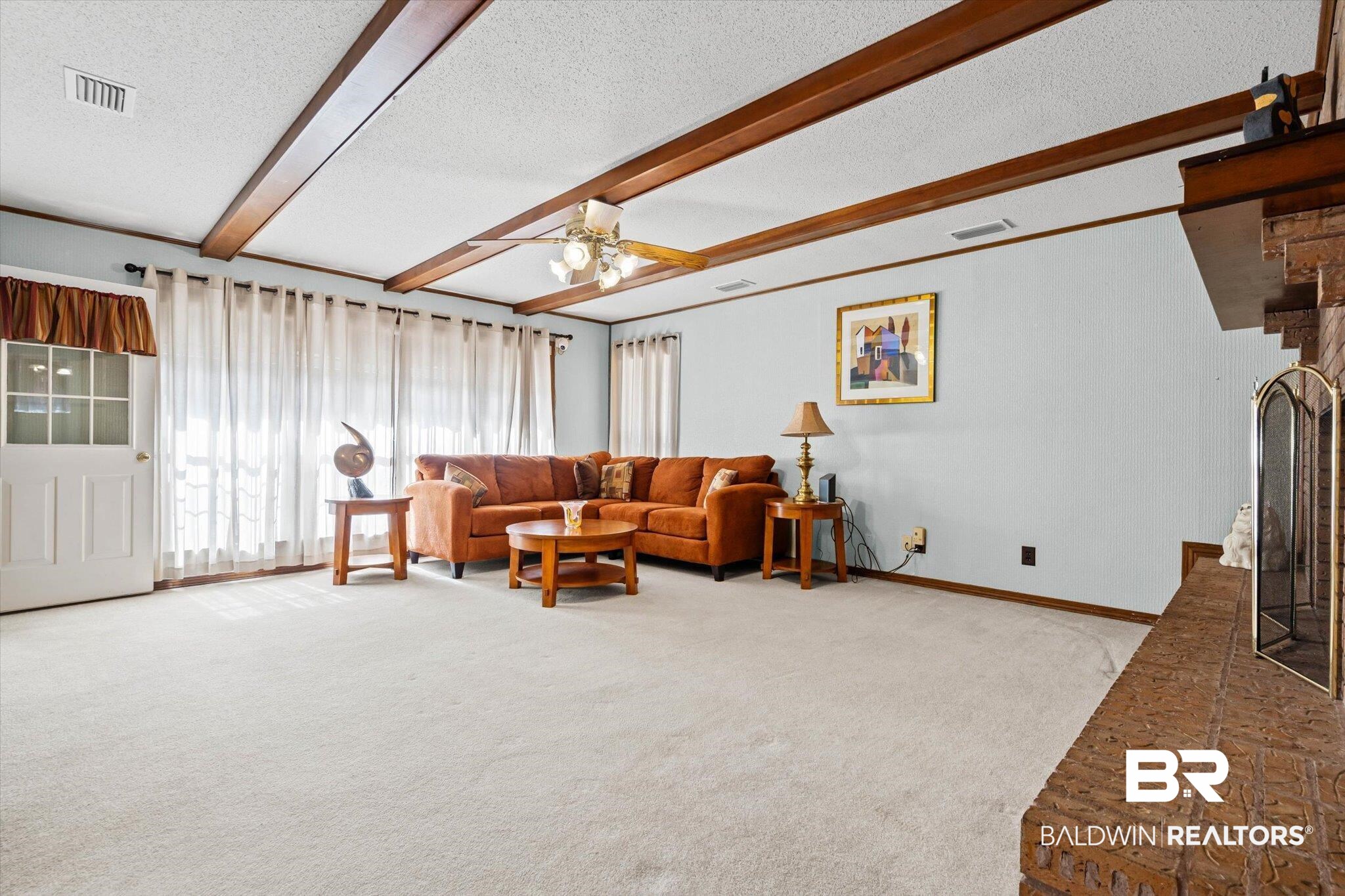 1900 Foxfire Road Mobile, AL 36618 - Photo 7 of 36 Living room featuring light colored carpet, a textured ceiling, beam ceiling, and ceiling fan
