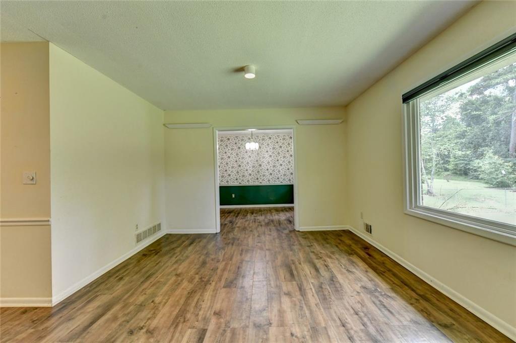 1577 Harbour Oaks Road Tucker, GA 30084 - Photo 7 of 58 a view of hallway with wooden floor and entryway