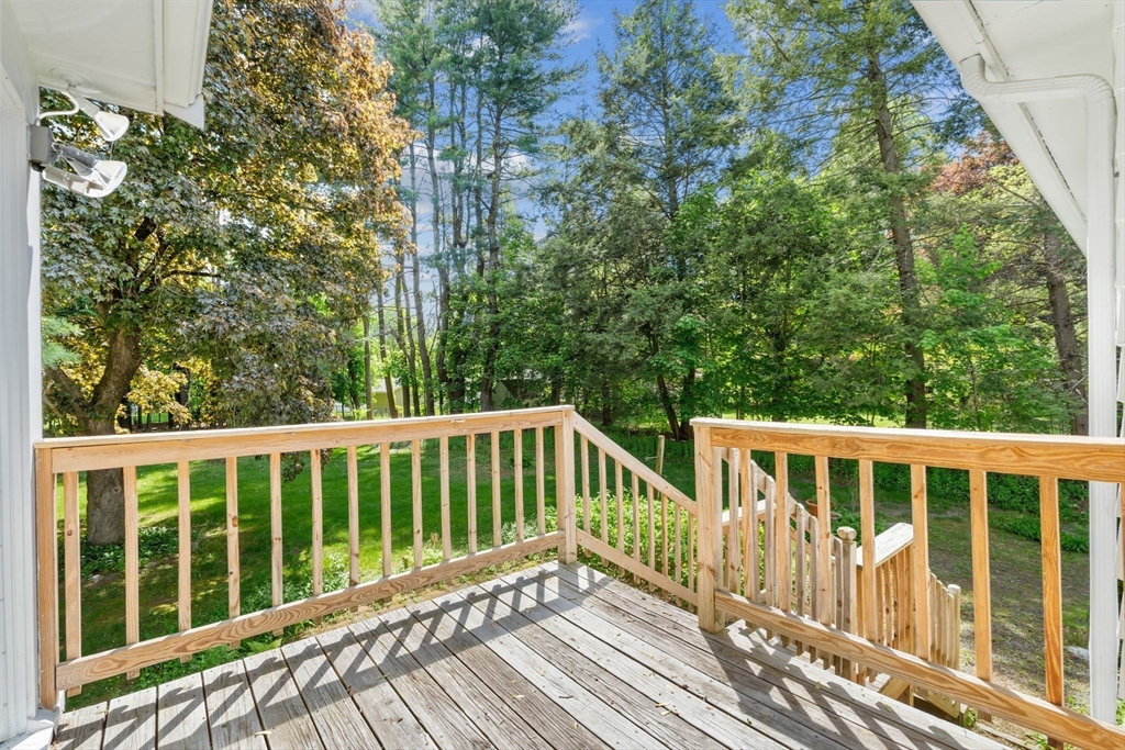 348 Belknap Road Framingham, MA 01701 - Photo 12 of 35 a view of a wooden deck with a yard