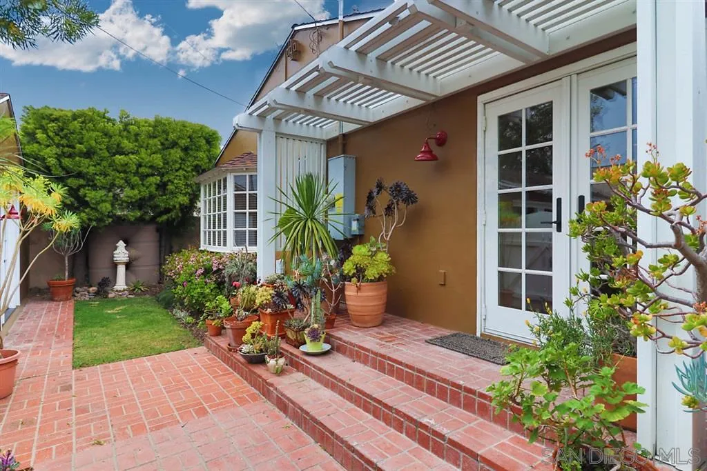 5004 Marlborough Drive San Diego, CA 92116 - Photo 17 of 25 a front view of a house with a yard