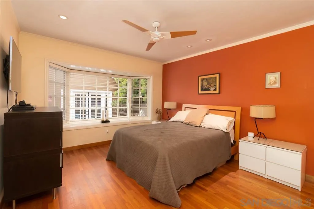 5004 Marlborough Drive San Diego, CA 92116 - Photo 18 of 25 a bed room with a bed and a night stand