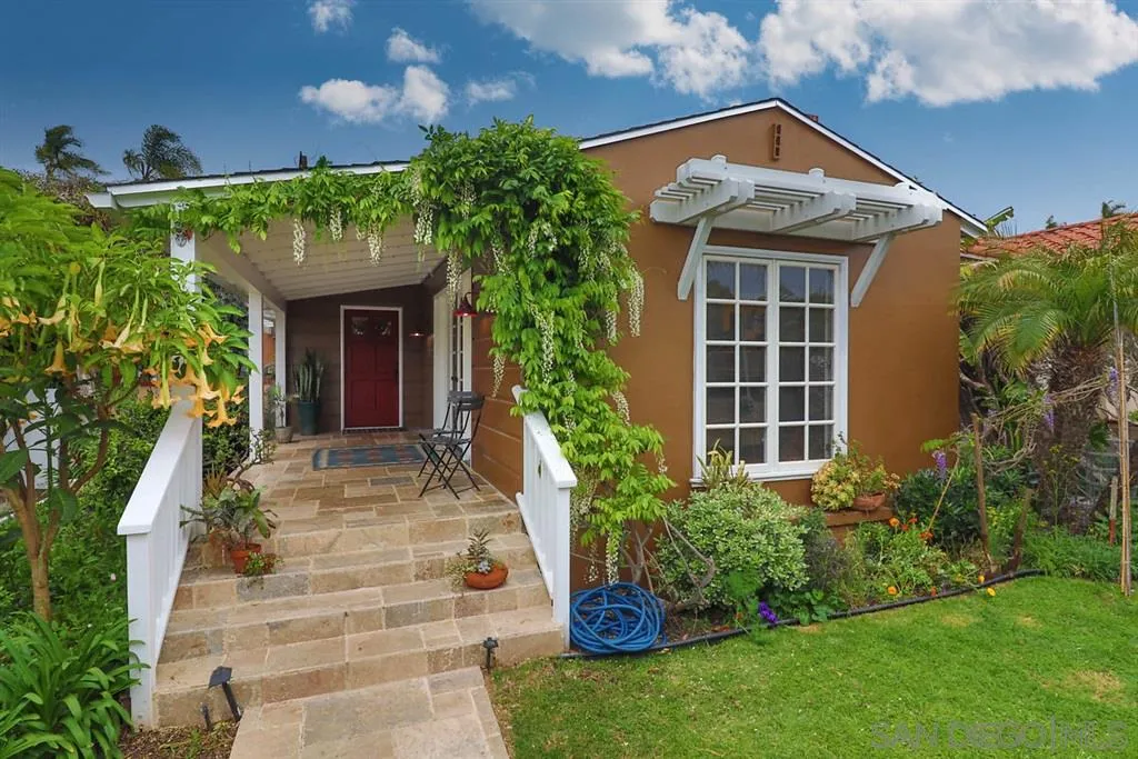 5004 Marlborough Drive San Diego, CA 92116 - Photo 2 of 25 a front view of a house with a yard
