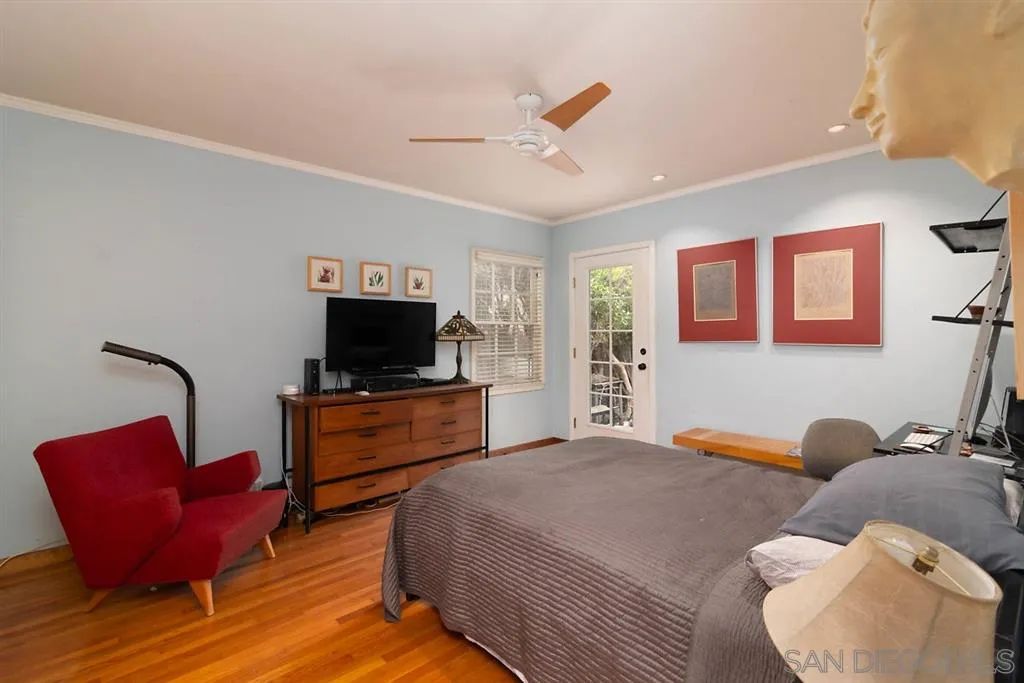 5004 Marlborough Drive San Diego, CA 92116 - Photo 21 of 25 a bedroom with furniture and a flat screen tv