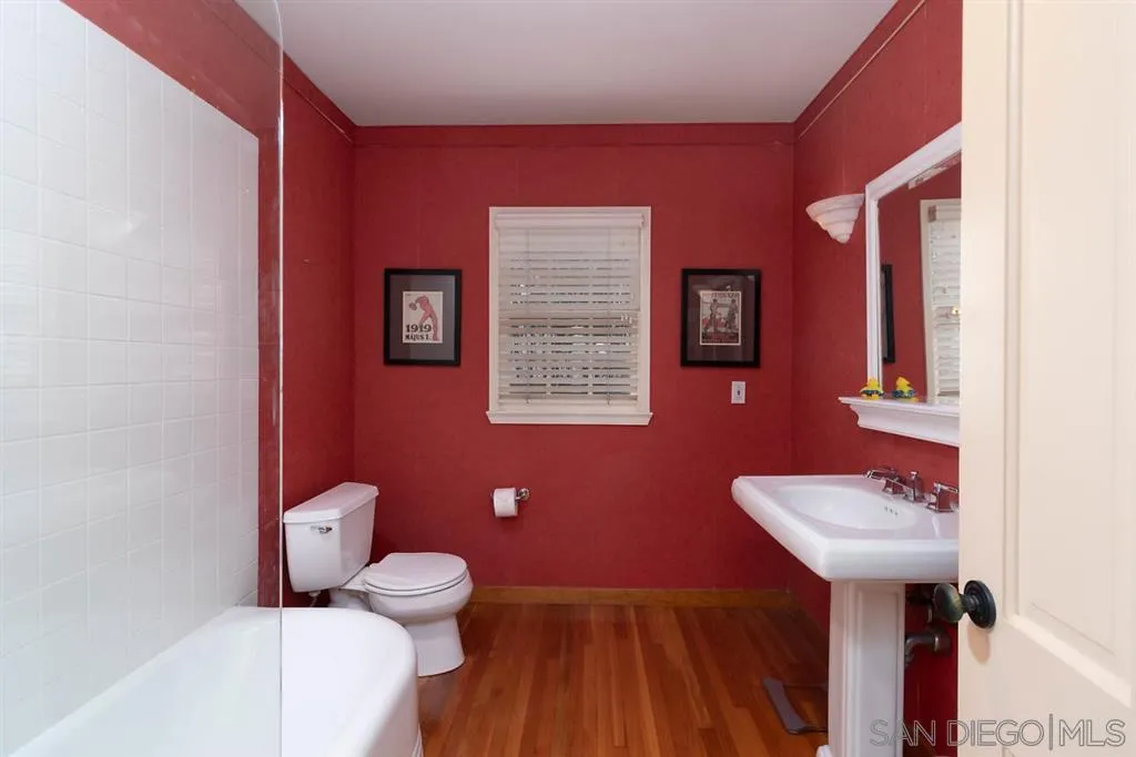 5004 Marlborough Drive San Diego, CA 92116 - Photo 23 of 25 a bathroom with a sink mirror and toilet