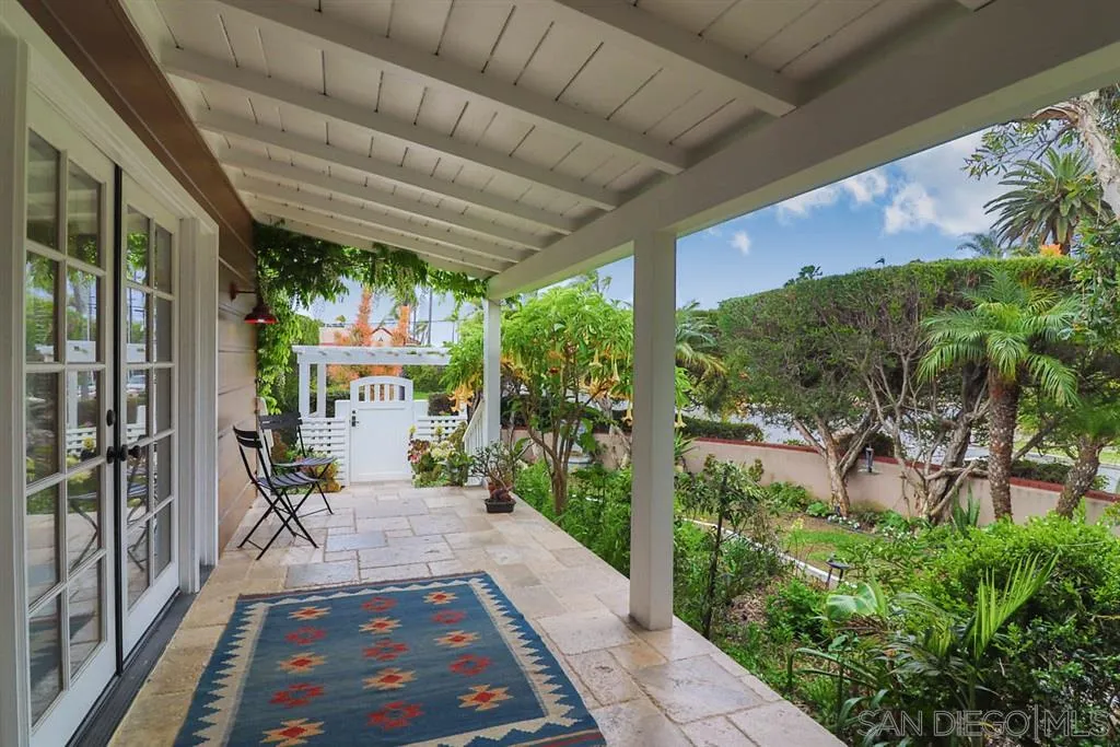 5004 Marlborough Drive San Diego, CA 92116 - Photo 6 of 25 a view of a patio with table and chairs potted plants and palm tree