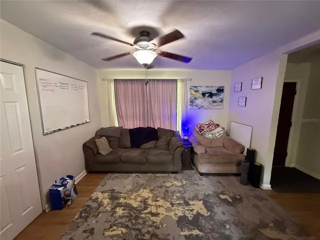 a living room with furniture and a window