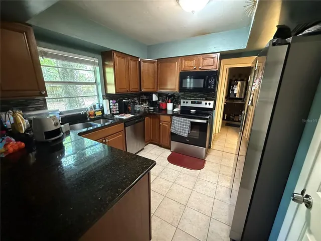 a kitchen with granite countertop lots of counter top space